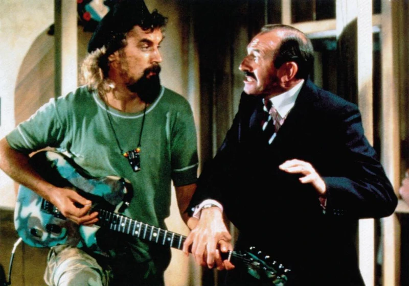 Billy Connolly y Leonard Rossiter en loca-juerga-tropical