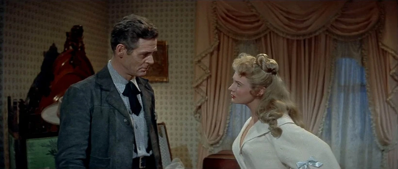 Robert Ryan y Virginia Mayo en tierra-de-violencia