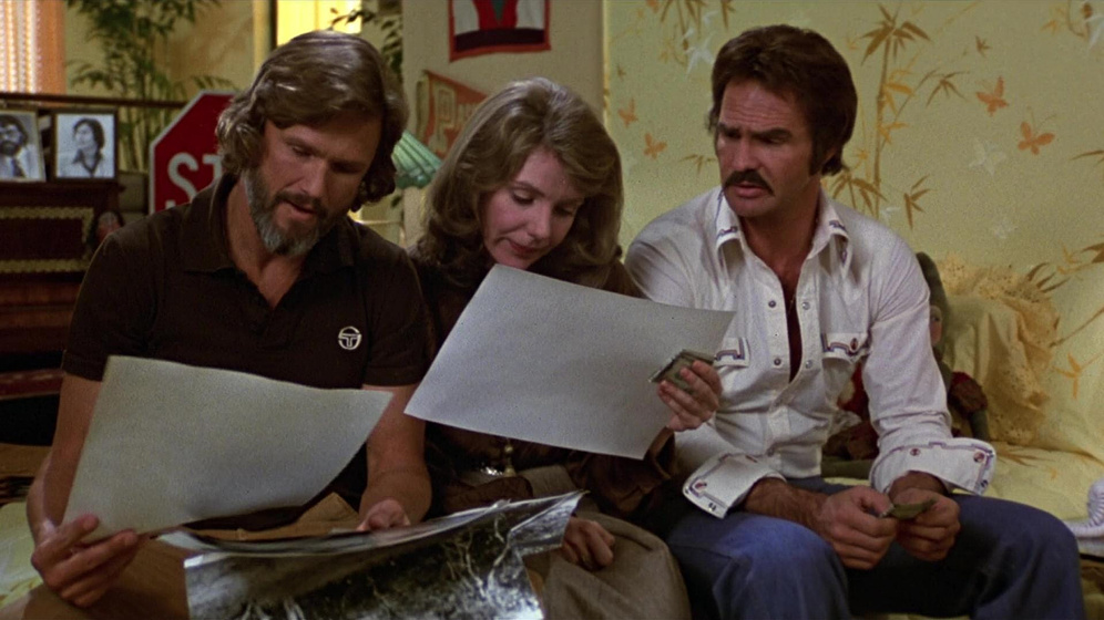Kris Kristofferson, Burt Reynolds y Jill Clayburgh en Dos más uno... igual a dos
