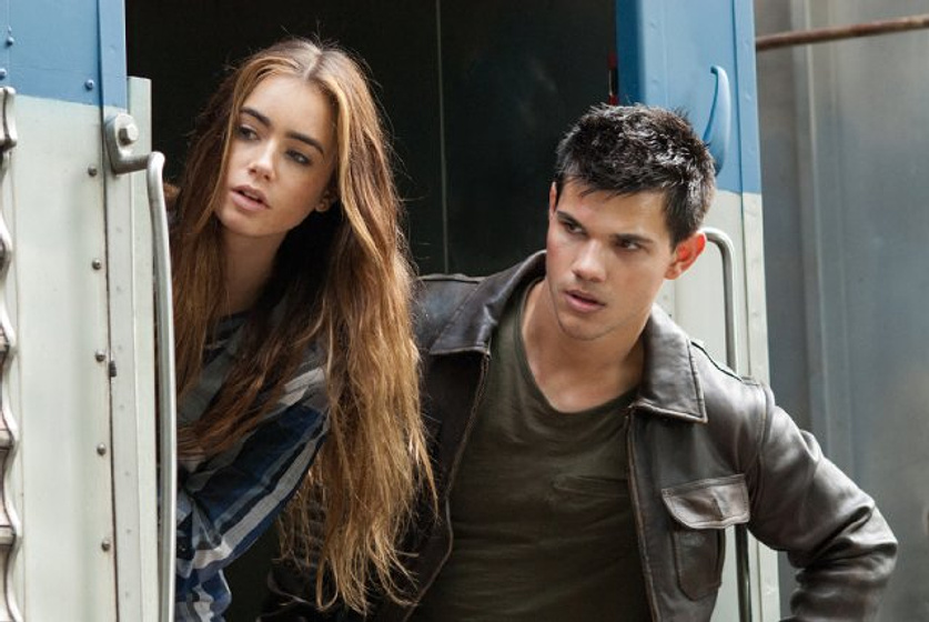 Taylor Lautner y Lily Collins en Sin Salida