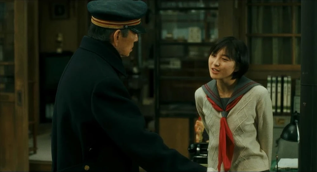 Ryoko Hirosue y Ken Takakura en poppoya-railroad-man