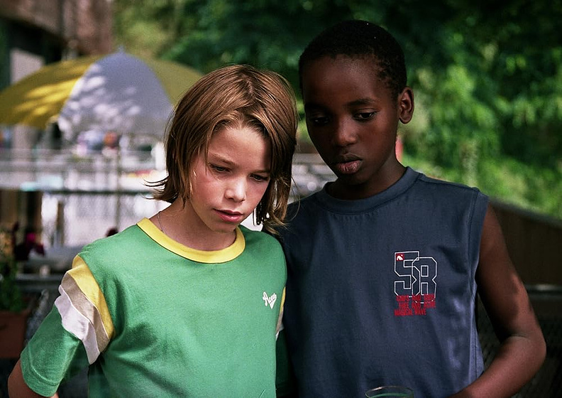 Ilya Van Malderghem y Willy Manzi Kabera en gilles