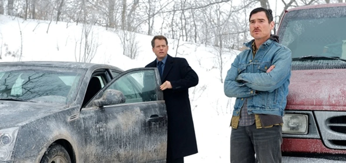 Greg Kinnear y Billy Crudup en timo-bajo-cero