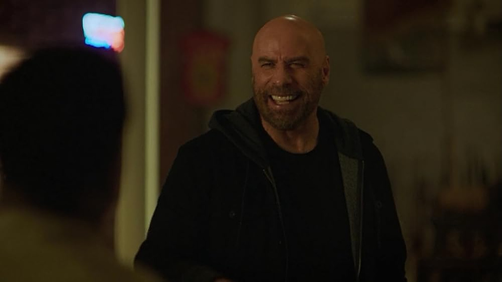 John Travolta en Muere, Hart