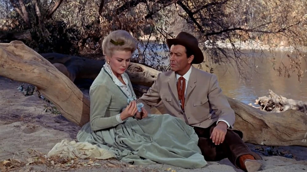 Robert Taylor [I] y Joan Caulfield en pistolas-en-la-frontera