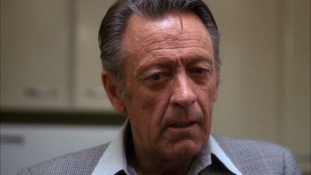 William Holden en Network, un Mundo Implacable